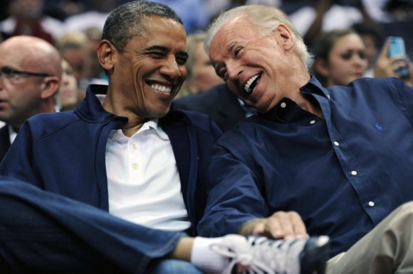 WASHINGTON, DC - JULY 16: U.S. President Barack Obama and Vice President Joe Biden share a laugh as the US Senior Men's National Team and Brazil play during a pre-Olympic exhibition basketball game at the Verizon Center on July 16, 2012 in Washington, DC. (Photo by Patrick Smith/Getty Images)